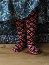 hand knitted stockings, bright pink with black